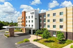 an aerial view of a hotel with a parking lot at Fairfield Inn & Suites by Marriott Wentzville in Wentzville