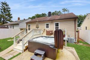 a hot tub on the patio of a house at Beach Bungalow Getaway in Michigan City