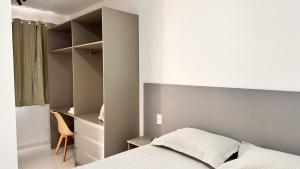 a bedroom with a bed and a chair in it at Dona Olivia Universidade in Vitória da Conquista +16 photos
