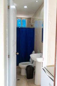 a bathroom with a toilet and a sink at Hotel cotubanama in Cayo Garza +10 photos