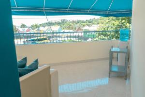 a view of a balcony with a blue canopy at Hotel cotubanama in Cayo Garza