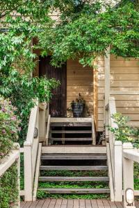 a stairway leading up to a house with a plant at Heritage Trail Lodge in Margaret River Town