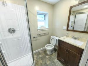 a bathroom with a shower and a toilet and a sink at Private Cozy 2bdrm Sleep5pp Metrotown! Free Parking! Self Check-in! in Burnaby +19 photos