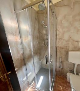 a shower with a glass door in a bathroom at Da Raffaella affittacamere in Cicciano +43 photos