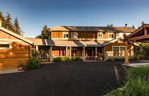 a large house with a driveway in front of it at Langley House - Water & Mountain Views, Hot Tub, Firepit in Langley