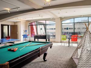 a billiard room with a pool table and a hammock at Sheraton Steamboat Resort Villas Hotel Apartment with Resort Access in Steamboat Springs