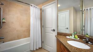 a bathroom with a sink and a shower and a tub at Marriott's StreamSide - Birch Studio Apartment with Resort Access in Vail