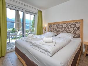Postel nebo postele na pokoji v ubytování Green Garden Lodge A2 Walchen-Kaprun