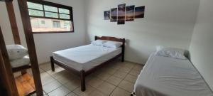 Postel nebo postele na pokoji v ubytování BareSun casa para 12 pessoas em Barequeçaba + 23 fotografií