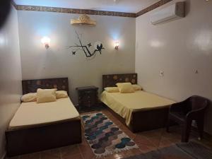 Ένα ή περισσότερα κρεβάτια σε δωμάτιο στο Al Sharif Hotel Apartments