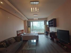 Μια τηλεόραση ή/και κέντρο ψυχαγωγίας στο Apple Community North District Serviced Apartment +1 φωτογραφίες