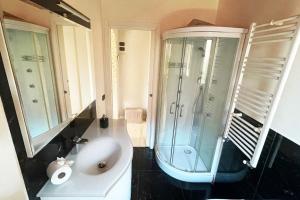 a bathroom with a shower and a sink and a toilet at Il nido di Giulia in Montevettolini