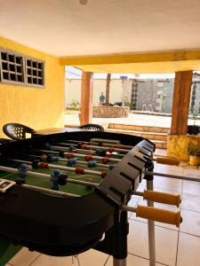 a pool table with balls on it in a room at Casa Temporada Bela Vista in Pirenópolis