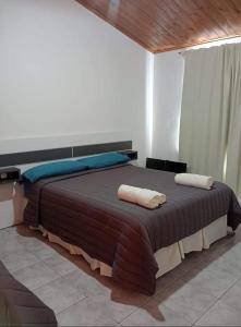 Ένα ή περισσότερα κρεβάτια σε δωμάτιο στο Los Nyck's