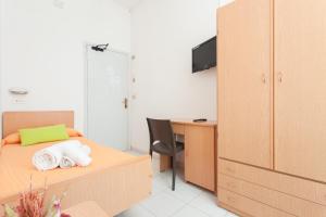 Postel nebo postele na pokoji v ubytování Hotel Niagara