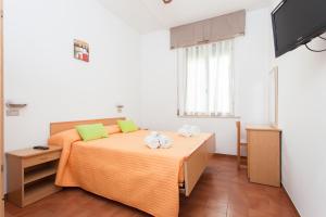 Postel nebo postele na pokoji v ubytování Hotel Niagara