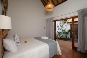 Ένα ή περισσότερα κρεβάτια σε δωμάτιο στο Tosca Villas, Two Bedrooms Pool Villa In Umalas +31 φωτογραφίες