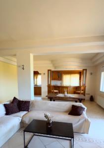 a living room with two white couches and a table at iLIONI-Corfu Luxe Living-Modern 2BR,2BA,Close to the sea in Vátos +22 photos