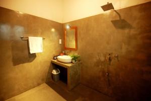 a bathroom with a sink and a shower at Hiriketiya Nanda Homestay in Dickwella