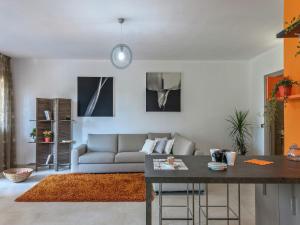 a living room with a couch and a table at Tranquil Escape in Tavullia in Tavullia