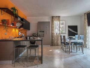 a kitchen and dining room with a table and chairs at Tranquil Escape in Tavullia in Tavullia