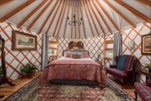 a bedroom with a bed in a yurt at Equestrian Elegance - Unit #8 in Woodway