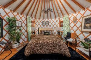 a bedroom with a bed in a yurt at Jungle Haven Yurt- Unit #2 in Woodway