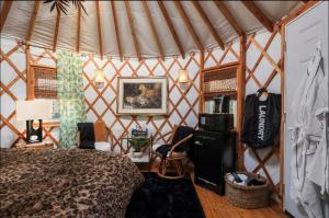 a bedroom with a bed in a yurt at Jungle Haven Yurt- Unit #2 in Woodway