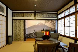 a room with a view of a mountain through a window at 善-zen- in Gujo