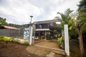 a pizza house with a sign in front of it at Playa Lodge in El Valle