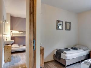 a bedroom with two beds and a sink at Chalet in Leogang near Ski Lifts in Leogang