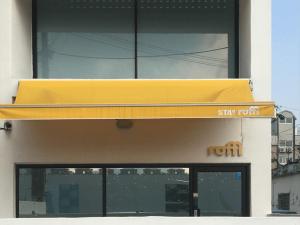 a yellow awning on the side of a building at Gyeongju Stayrophy Eupseong Branch in Gyeongju