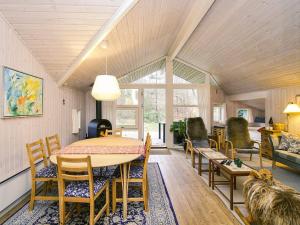 a living room with a table and chairs at 7 person holiday home in Rørvig in Rørvig