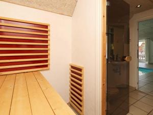 a room with a wooden wall next to a door at 18 person holiday home in Ulfborg-By Traum in Øby
