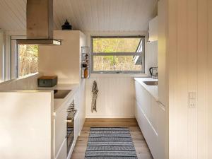 a small kitchen with a sink and a window at 10 person holiday home in Jerup-By Traum in Jerup +14 photos