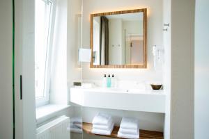 Koupelna v ubytování ABC Hotel