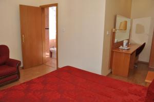 Cama ou camas em um quarto em Hotel Solneve