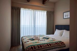 Katil atau katil-katil dalam bilik di Hotel134 鎌倉