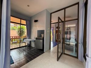 a room with a view of a room with a balcony at Sawasdee House in Lamai +69 photos