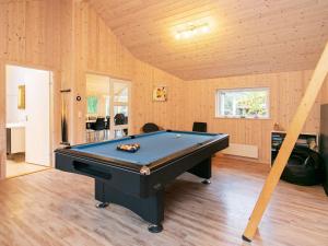 a pool table in the middle of a room at 12 person holiday home in Hals-By Traum in Hals +12 photos