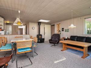 a living room with a couch and a table at 8 person holiday home in Hurup Thy-By Traum in Sindrup