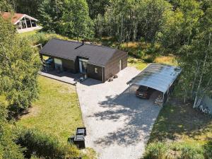 an overhead view of a small house with a roof at 8 person holiday home in Læsø-By Traum in Læsø +27 photos