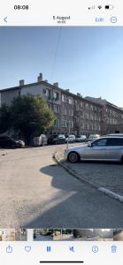 a picture of a car parked in a parking lot at Kiwi Apartment in Veliko Tŭrnovo