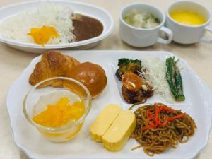 a white plate of food with noodles and other foods at Toyoko Inn Osaka Namba Nishi in Osaka