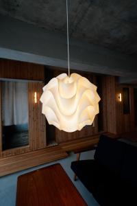 a large white chandelier hanging in a living room at Alternest Kamakura in Kamakura +52 photos