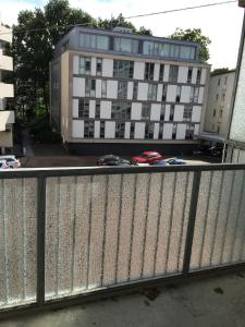 a bridge with a building in the background with cars at Charmantes City-Apartment in der Altstadt in Bremen