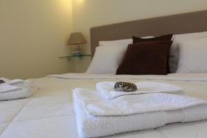 a room with two white towels on a bed at Swiss Residence Montenegro in Herceg-Novi