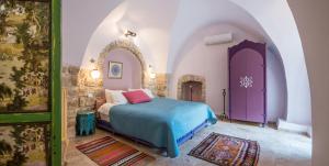 Postel nebo postele na pokoji v ubytování The Way Inn - Boutique Suites