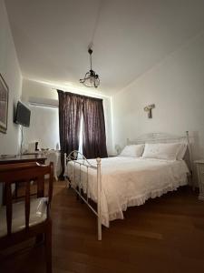 Ένα ή περισσότερα κρεβάτια σε δωμάτιο στο Villa Radiosa