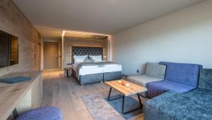 Postel nebo postele na pokoji v ubytování Hotel Madonna